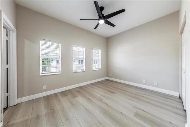 an empty room with a bathroom and a sink