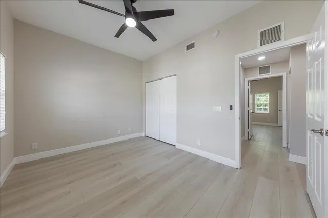 an empty room with a bathroom and a bathroom