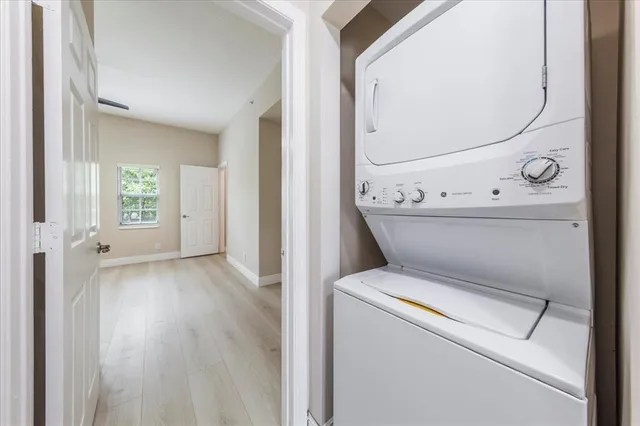 a bathroom with a double vanity sink mirror and shower