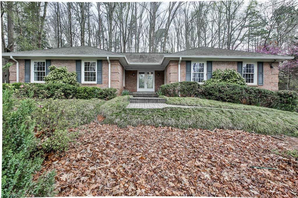 This handsome 4 sided brick ranch home sits on over an acre on a quiet dead end street.  The lot is just beautiful.  