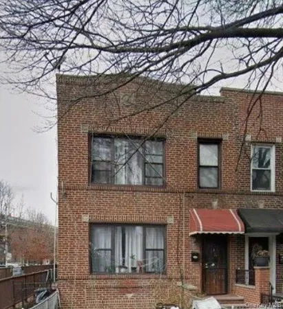 a front view of a building with parking space