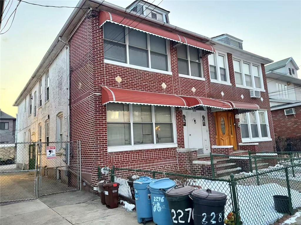 2276 78th Street Brooklyn, NY 11214 - Photo 3 of 16 a front view of a building with outdoor seating