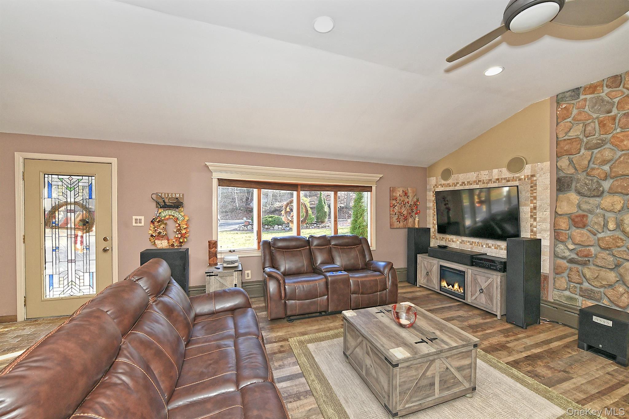 150 Hallock Landing Road Rocky Point, NY 11778 - Photo 12 of 36 Living room with vaulted ceiling, wood finished floors, a ceiling fan, and recessed lighting