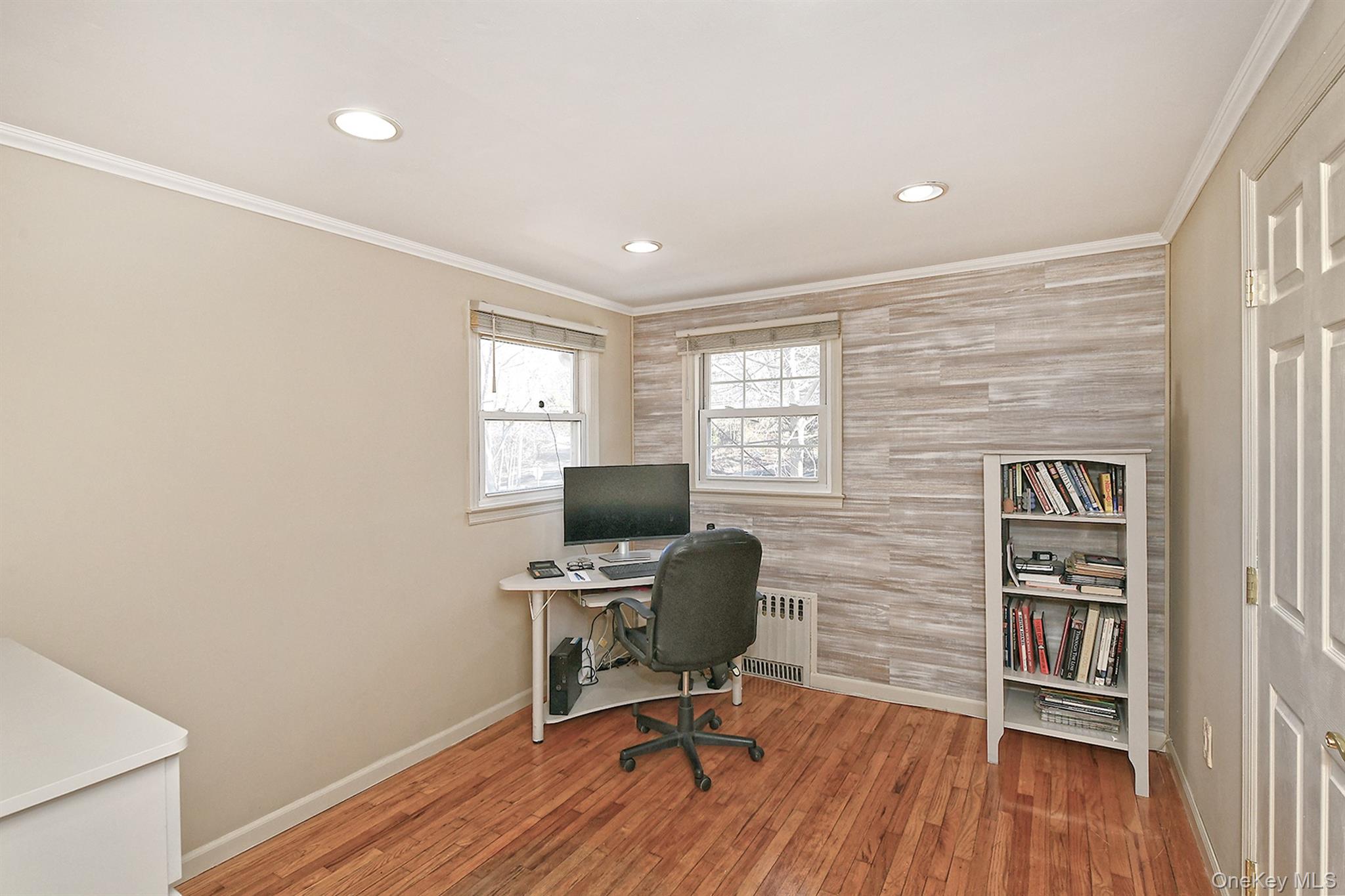 150 Hallock Landing Road Rocky Point, NY 11778 - Photo 25 of 36 Home office with ornamental molding, light wood-style flooring, recessed lighting, and radiator heating unit