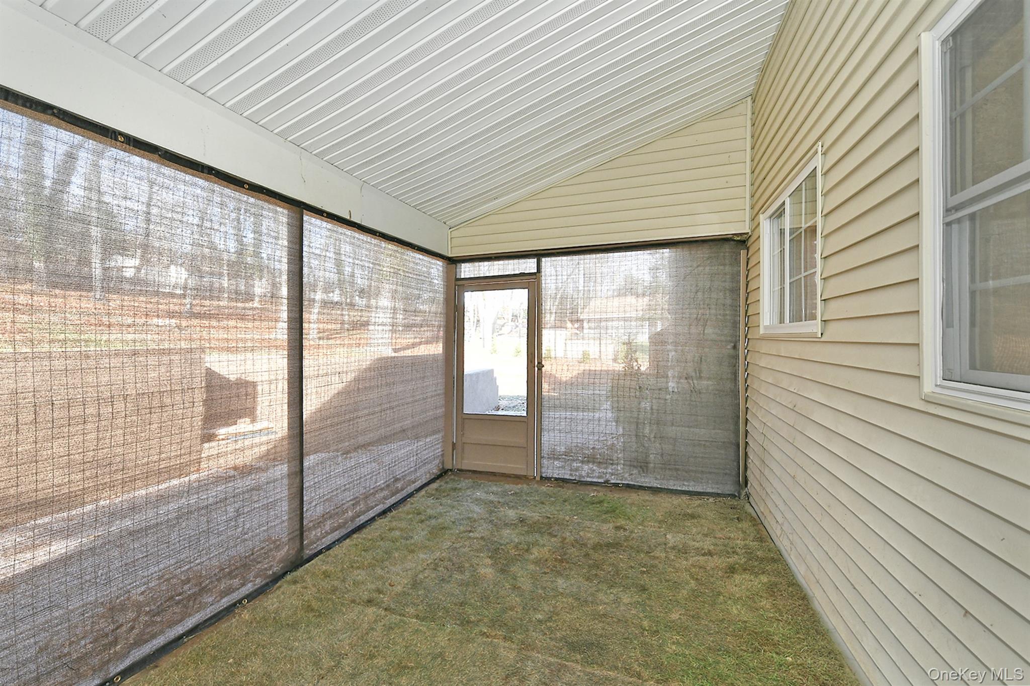150 Hallock Landing Road Rocky Point, NY 11778 - Photo 27 of 36 Unfurnished sunroom with lofted ceiling