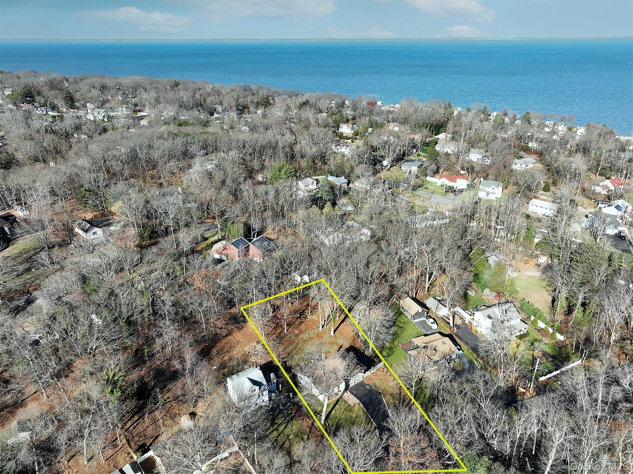150 Hallock Landing Road Rocky Point, NY 11778 - Photo 32 of 36 Aerial view of property and surrounding area with property boundaries highlighted and a nearby body of water