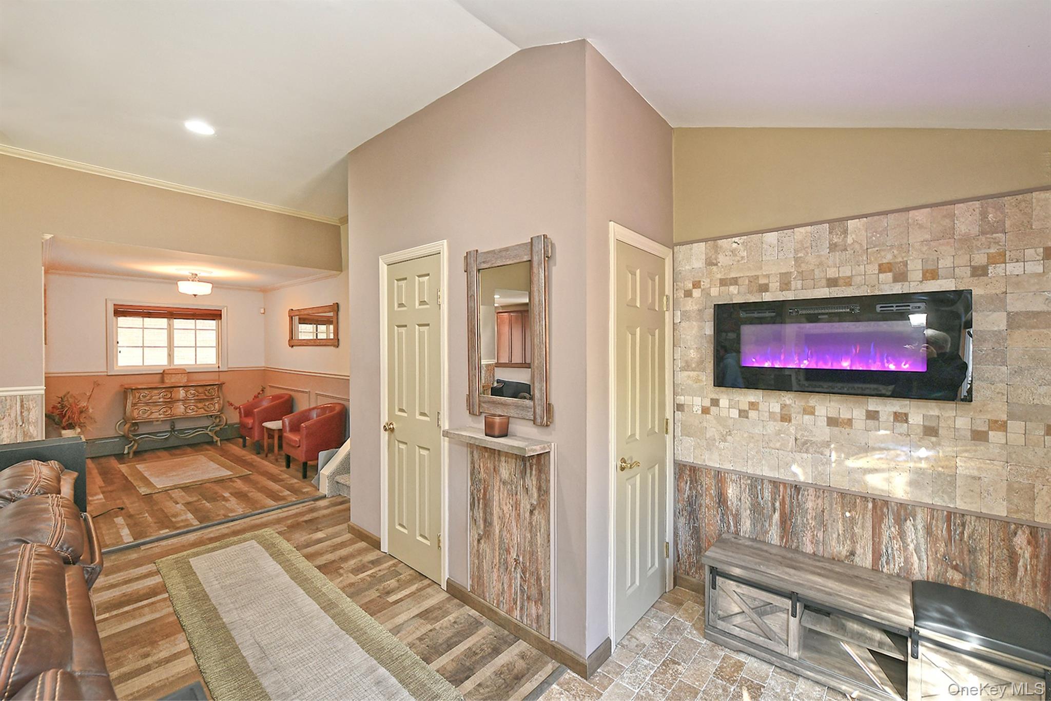 150 Hallock Landing Road Rocky Point, NY 11778 - Photo 8 of 36 Living room with a wainscoted wall and ornamental molding