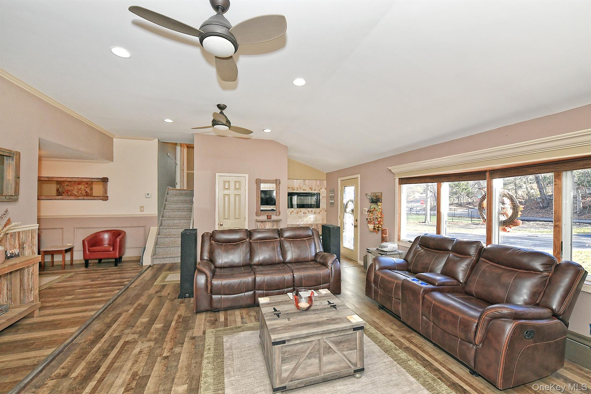 150 Hallock Landing Road Rocky Point, NY 11778 - Photo 10 of 36 Living room with stairway, recessed lighting, wood finished floors, lofted ceiling, and ceiling fan