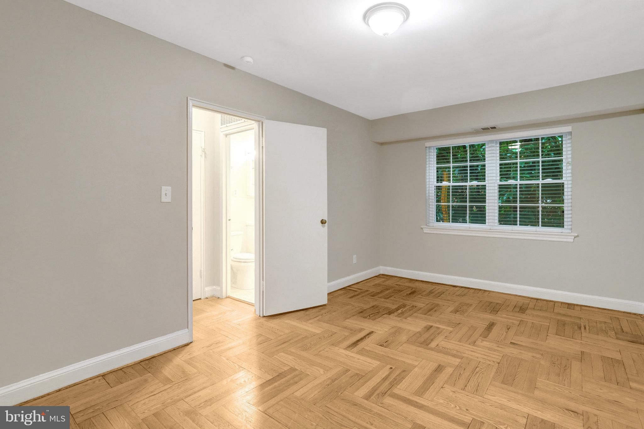 1307 North Ode Street, Unit 424 Arlington, VA 22209 - Photo 11 of 14 an empty room with windows