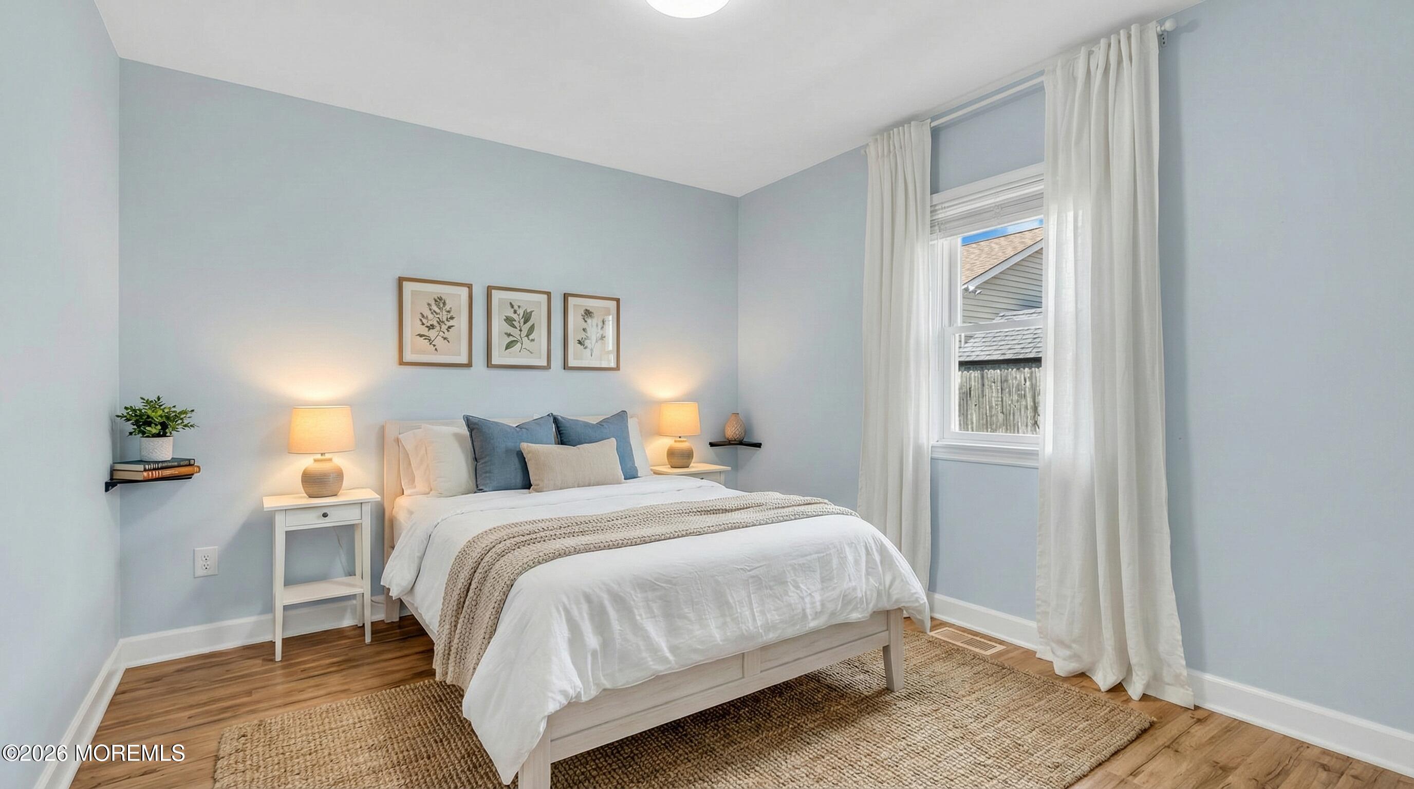 1407 Edgemere Road Wall, NJ 07719 - Photo 14 of 17 a bedroom with a bed and a window