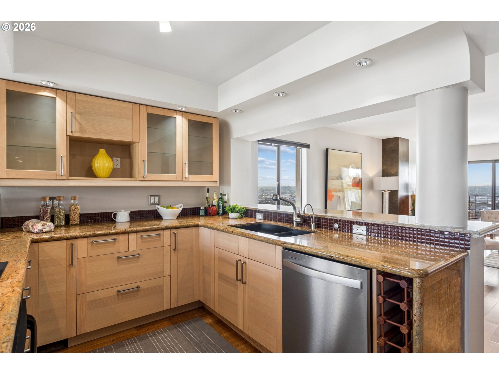 2211 Southwest 1st Avenue, Unit 1402 Portland, OR 97201 - Photo 20 of 48 a kitchen with sink a stove and cabinets