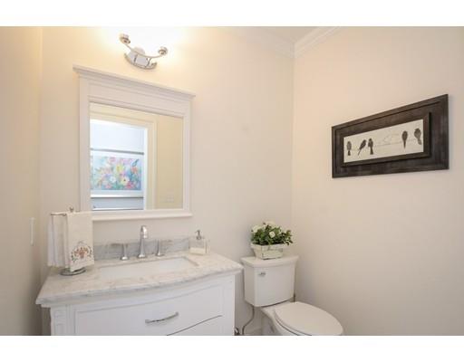 929 Beacon Street Newton, MA 02459 - Photo 15 of 36 a bathroom with a granite countertop sink mirror vanity and toilet