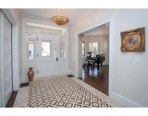 929 Beacon Street Newton, MA 02459 - Photo 2 of 36 a bedroom with a bed and furniture