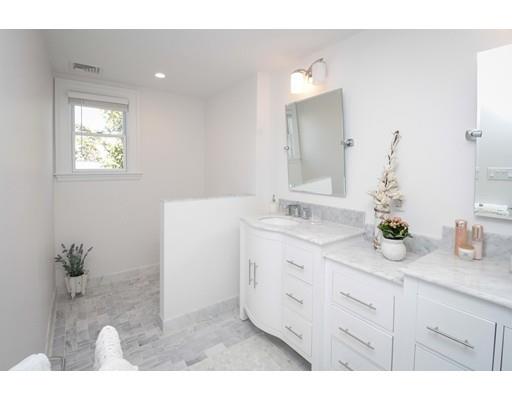 929 Beacon Street Newton, MA 02459 - Photo 21 of 36 a bathroom with a sink and a mirror