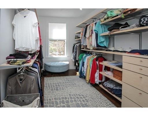 929 Beacon Street Newton, MA 02459 - Photo 23 of 36 a view of walk in closet with clothes and shoes