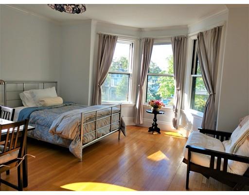 929 Beacon Street Newton, MA 02459 - Photo 26 of 36 a bedroom with a bed and a large window