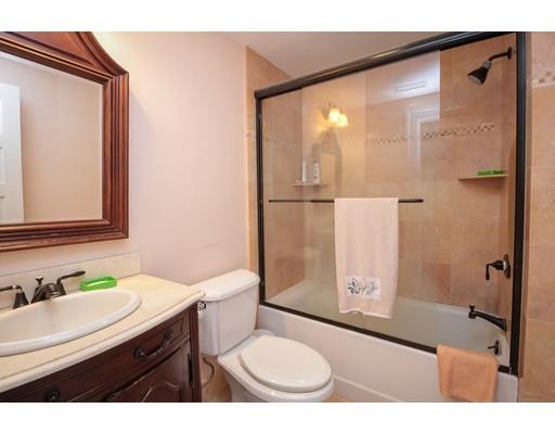 929 Beacon Street Newton, MA 02459 - Photo 27 of 36 a bathroom with a sink a toilet and shower