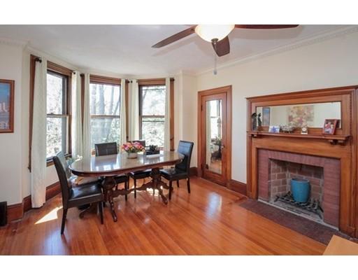 929 Beacon Street Newton, MA 02459 - Photo 30 of 36 a living room with furniture a fireplace and wooden floor