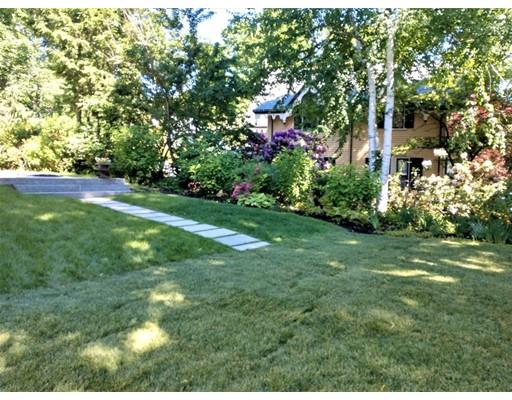 929 Beacon Street Newton, MA 02459 - Photo 35 of 36 a backyard of a house with lots of green space and garden