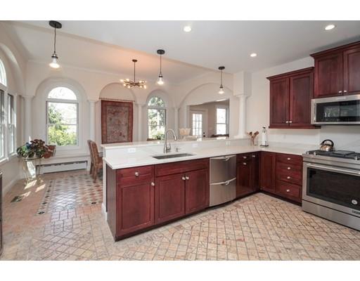 929 Beacon Street Newton, MA 02459 - Photo 9 of 36 a kitchen with a sink stove and cabinets