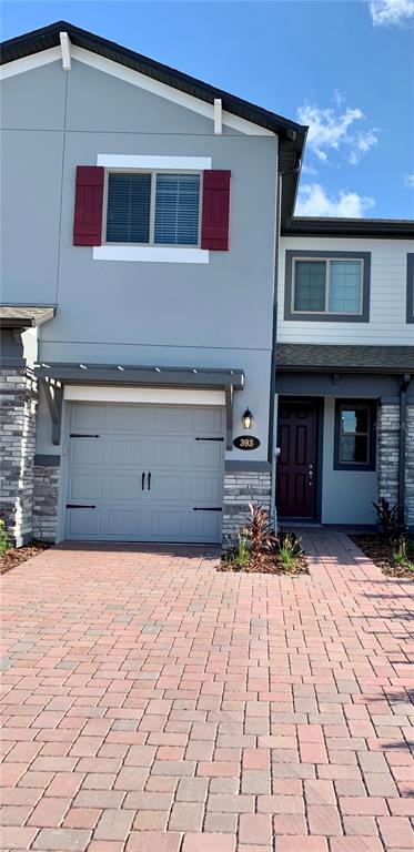 393 Evertree Loop Sanford, FL 32771 - Photo 1 of 1 a front view of a house with a yard