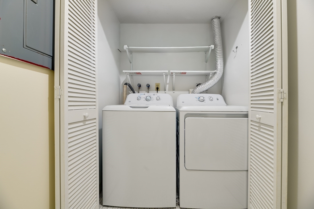321 Harvard Street, Unit 307 Cambridge, MA 02139 - Photo 18 of 26 a utility room with dryer and washer