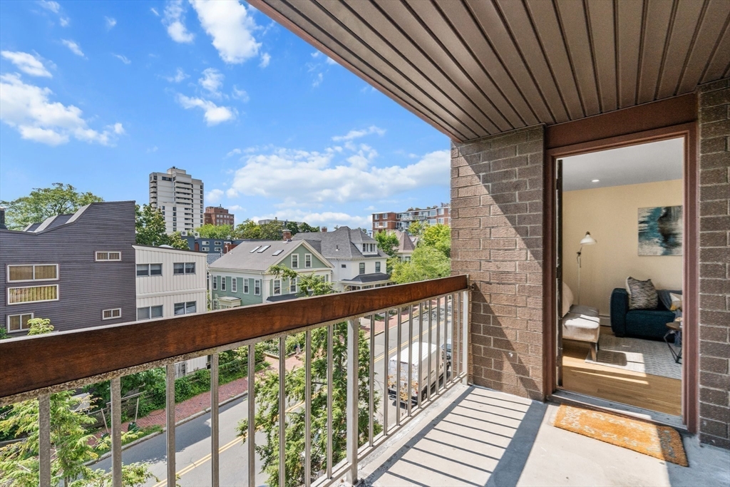 321 Harvard Street, Unit 307 Cambridge, MA 02139 - Photo 9 of 26 a view of city from a balcony