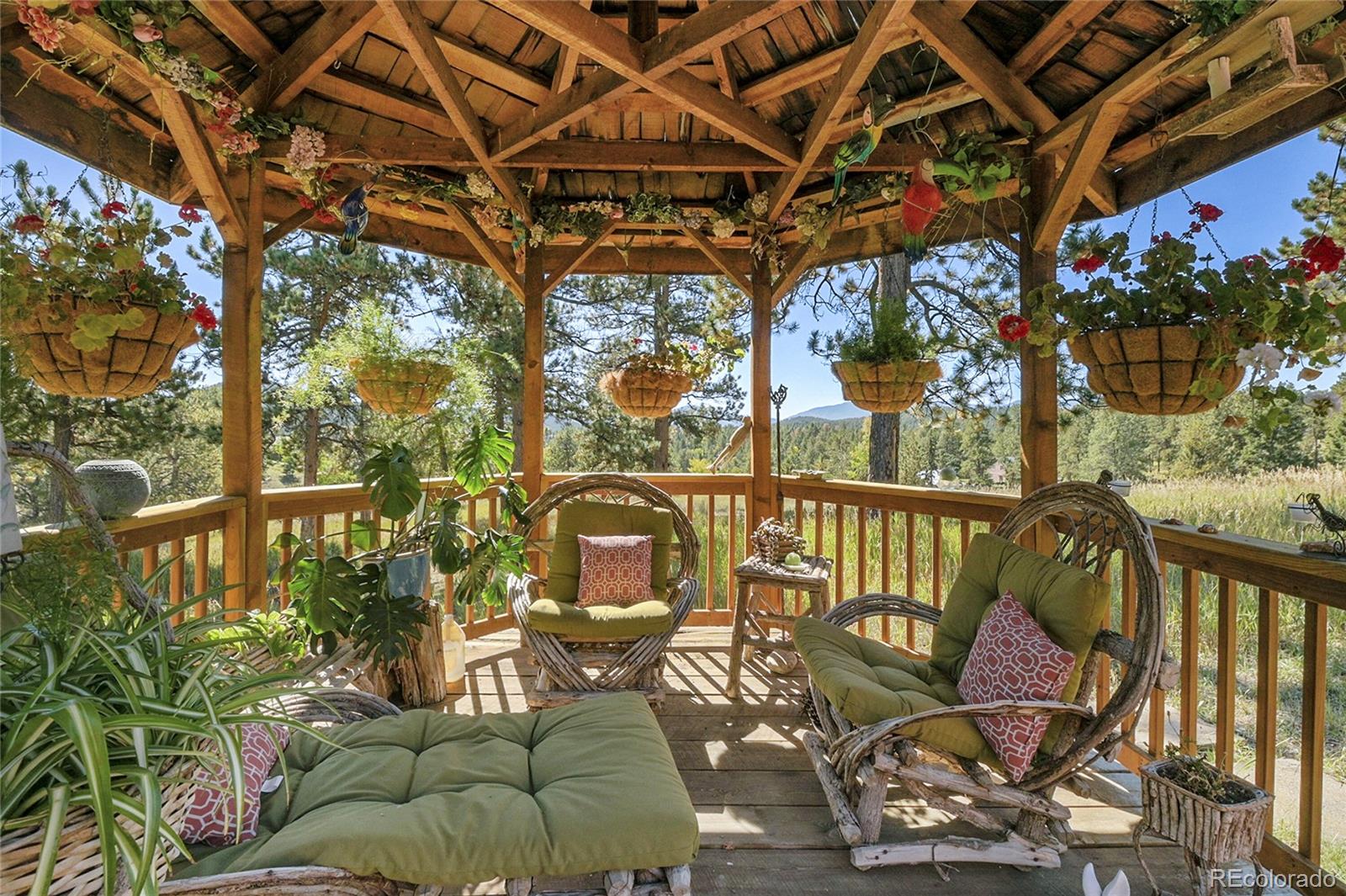 a view of a chairs and table in patio