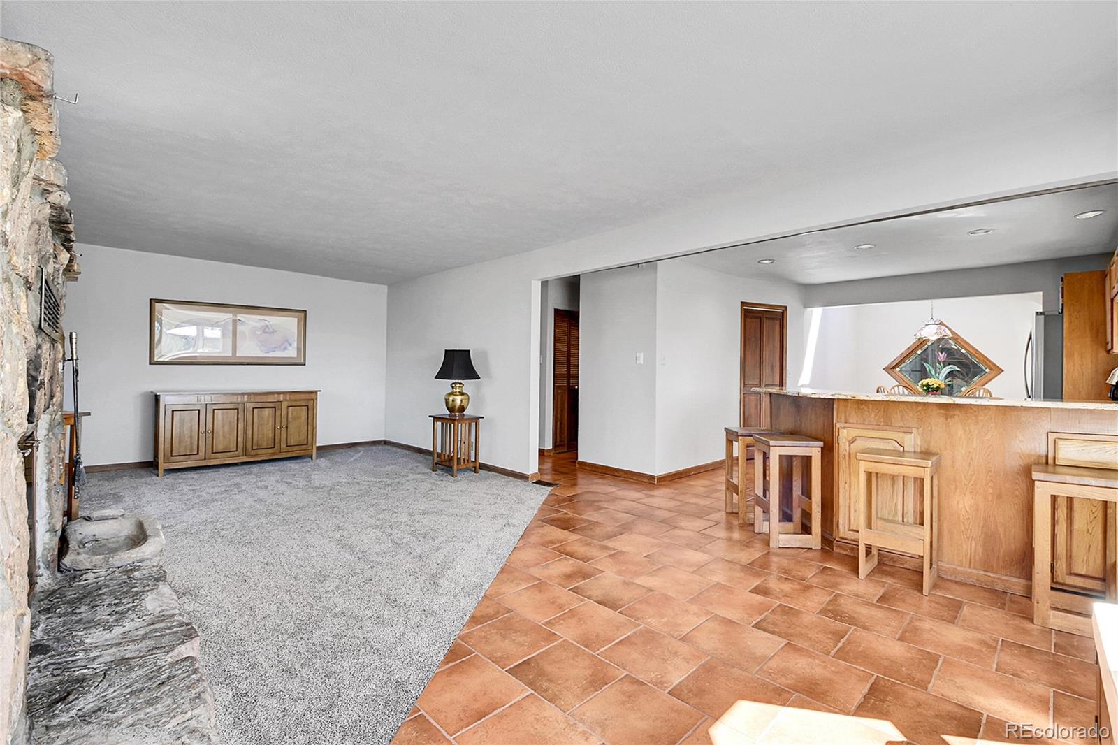 13082 South Wamblee Valley Road Conifer, CO 80433 - Photo 18 of 46 a view of livingroom with furniture and windows