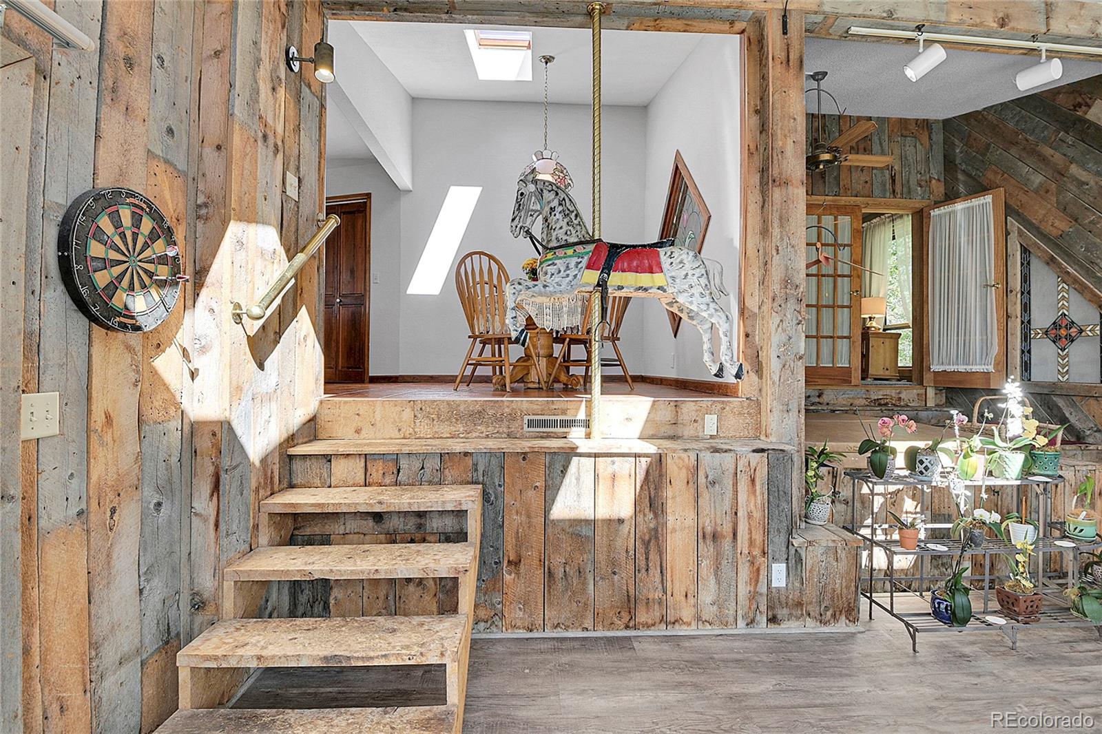 13082 South Wamblee Valley Road Conifer, CO 80433 - Photo 29 of 46 a view of front door with dining room