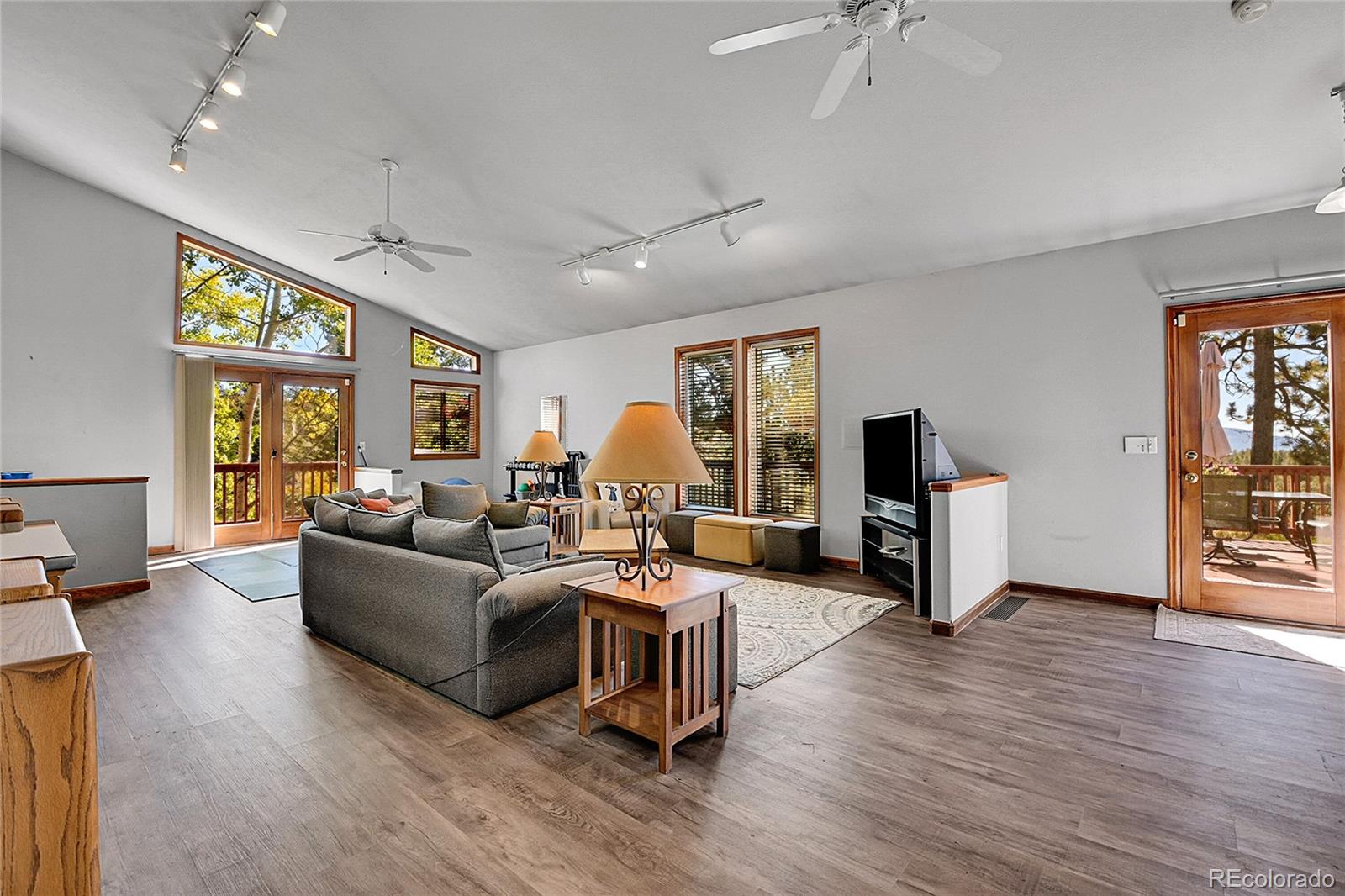13082 South Wamblee Valley Road Conifer, CO 80433 - Photo 30 of 46 a living room with furniture and a wooden floor