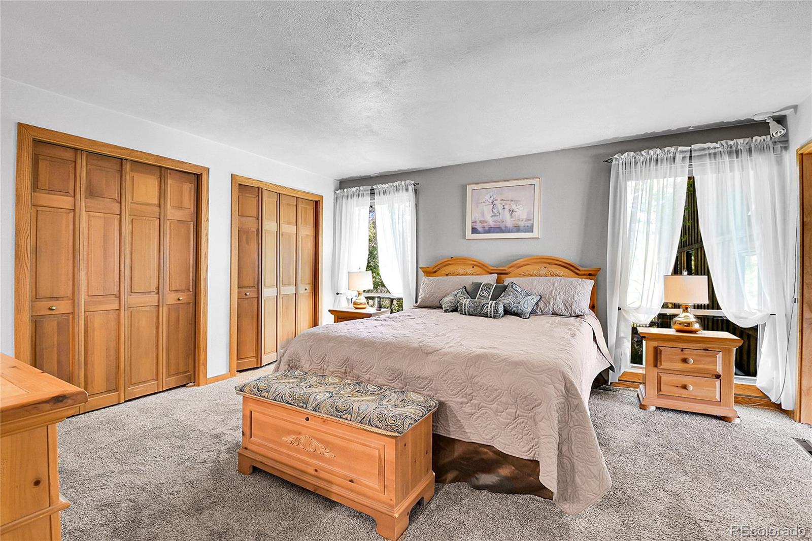 13082 South Wamblee Valley Road Conifer, CO 80433 - Photo 36 of 46 a bedroom with a bed and window