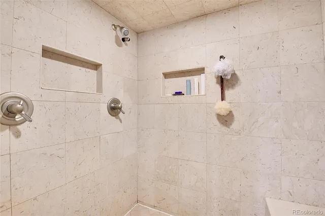 a dinning room with furniture and kitchen view