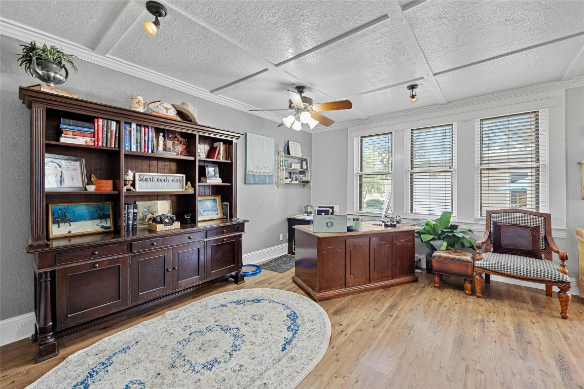 622 West 7th Street Taylor, TX 76574 - Photo 13 of 35 a living room with furniture and a wooden floor