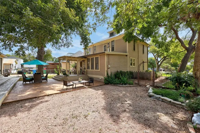 a view of a park with trees and a bench