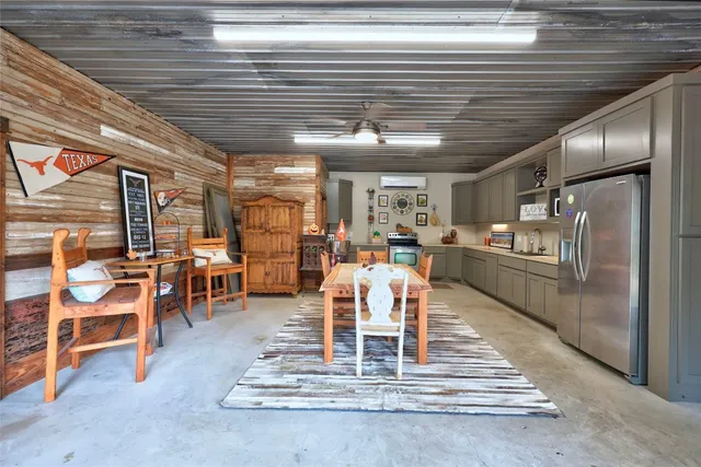 a living room with lots of furniture and a table