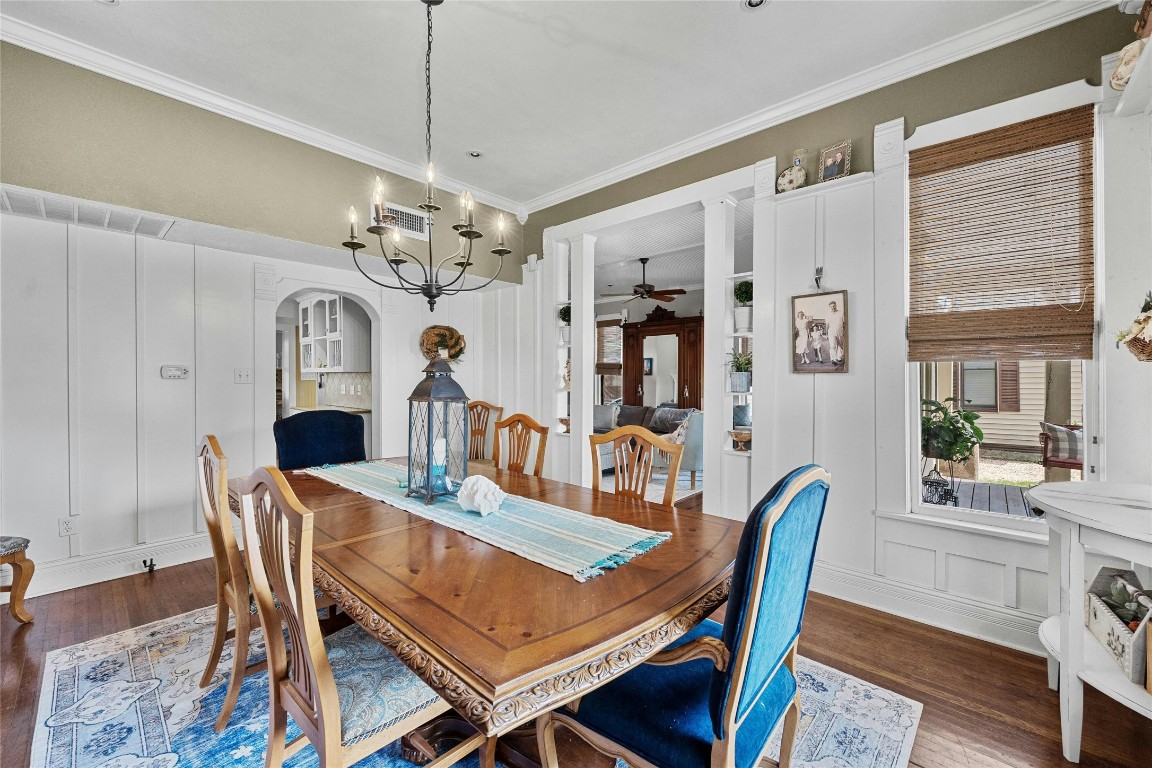 622 West 7th Street Taylor, TX 76574 - Photo 9 of 35 a view of a dining room with furniture a chandelier and wooden floor