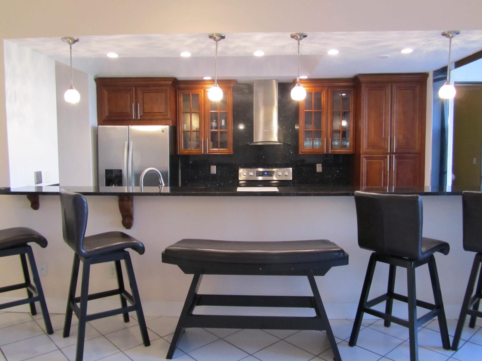 7448 La Paz Place, Unit 104 Boca Raton, FL 33433 - Photo 2 of 12 Dining area and kitchen