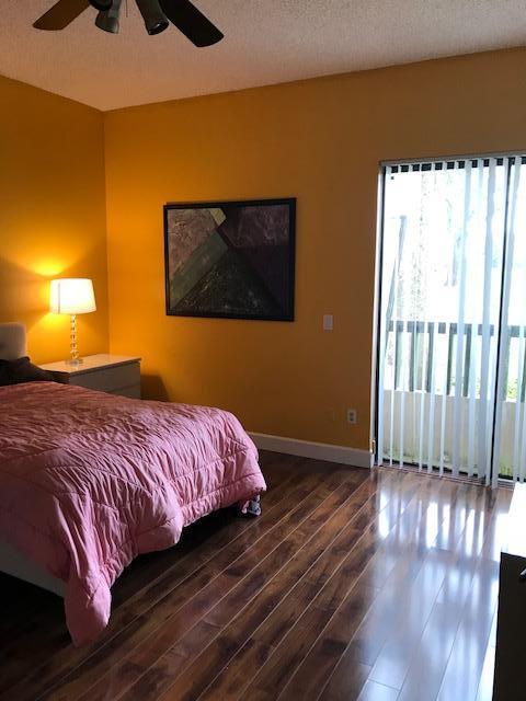 7448 La Paz Place, Unit 104 Boca Raton, FL 33433 - Photo 7 of 12 master bedroom