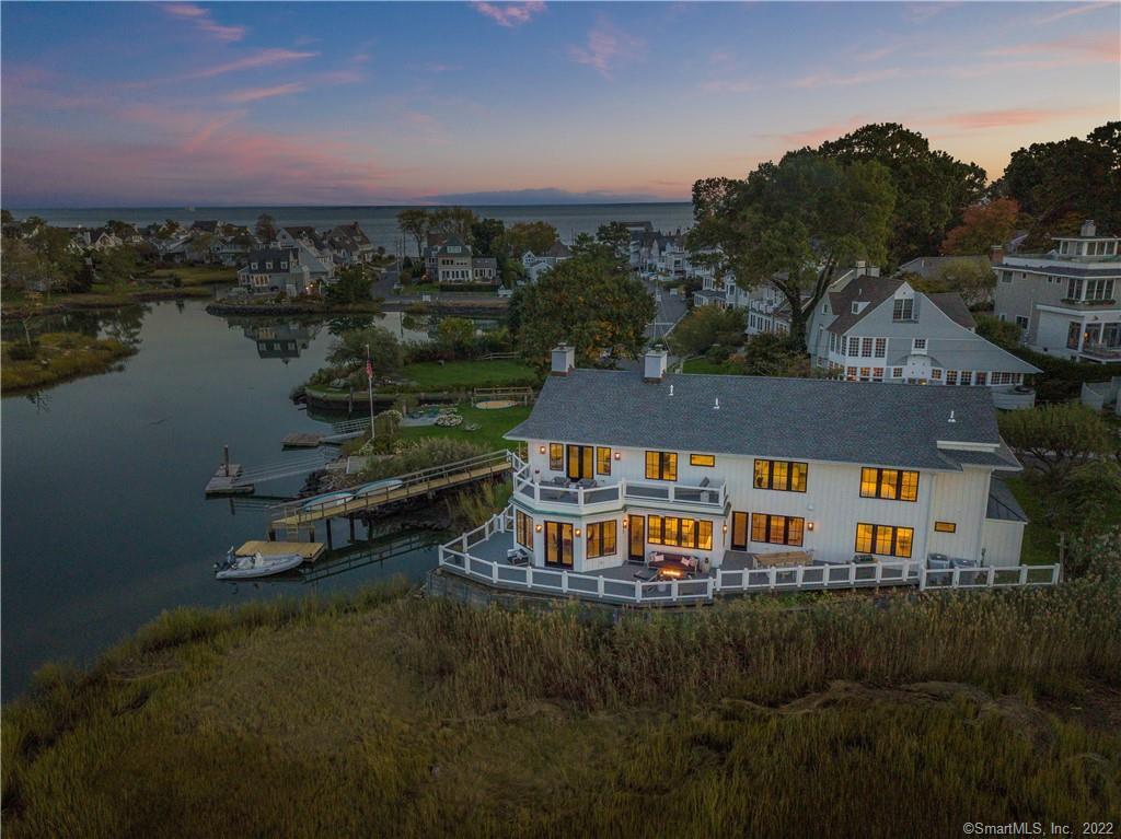 an aerial view of a house with a lake view