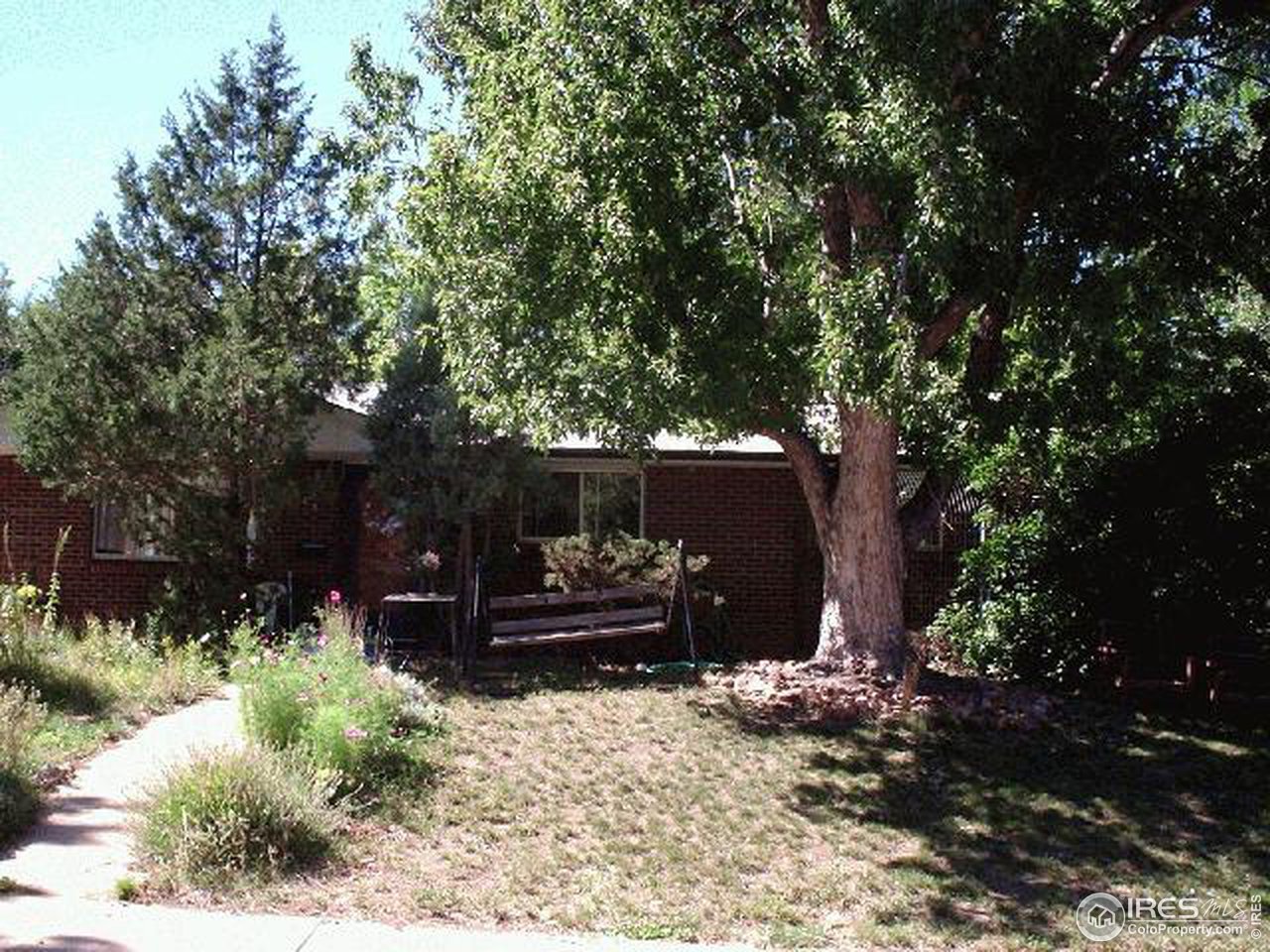 1205 Georgetown Road Boulder, CO 80305 - Photo 1 of 5 a view of a bench in a garden