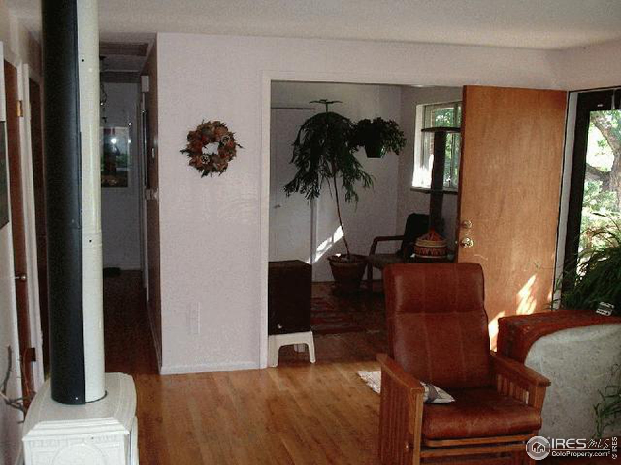 1205 Georgetown Road Boulder, CO 80305 - Photo 3 of 5 a living room with furniture and a potted plant