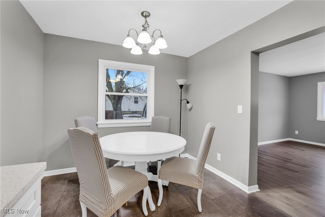 3930 Wadsworth Road Barberton, OH 44203 - Photo 9 of 30 Dining space with baseboards and a chandelier