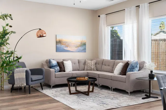 a bedroom with a large bed and a window