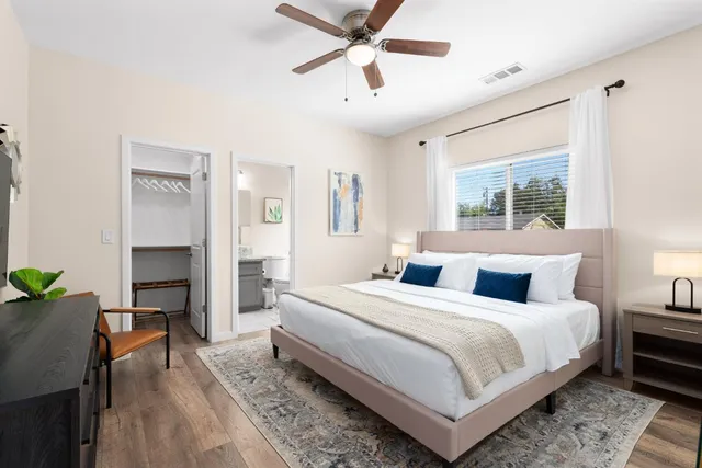 a bedroom with a bed and a window