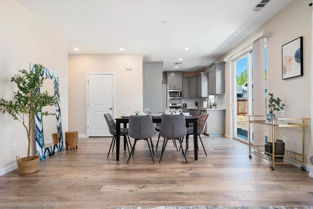 a kitchen with granite countertop a refrigerator stove and microwave