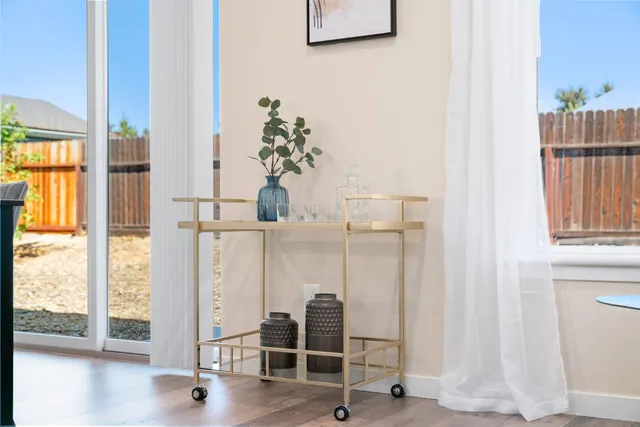 a kitchen with stainless steel appliances granite countertop a sink stove and microwave