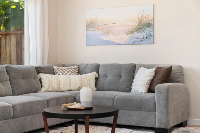 a bedroom with a bed and glass window