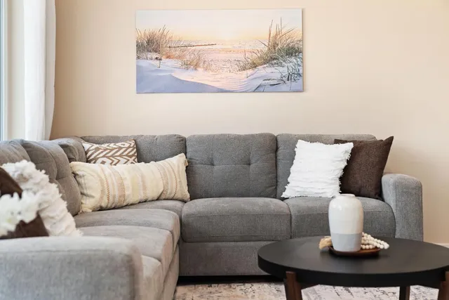 a bedroom with two beds and a large window