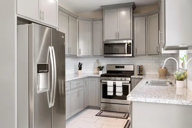 a bedroom with a bed and a lamp